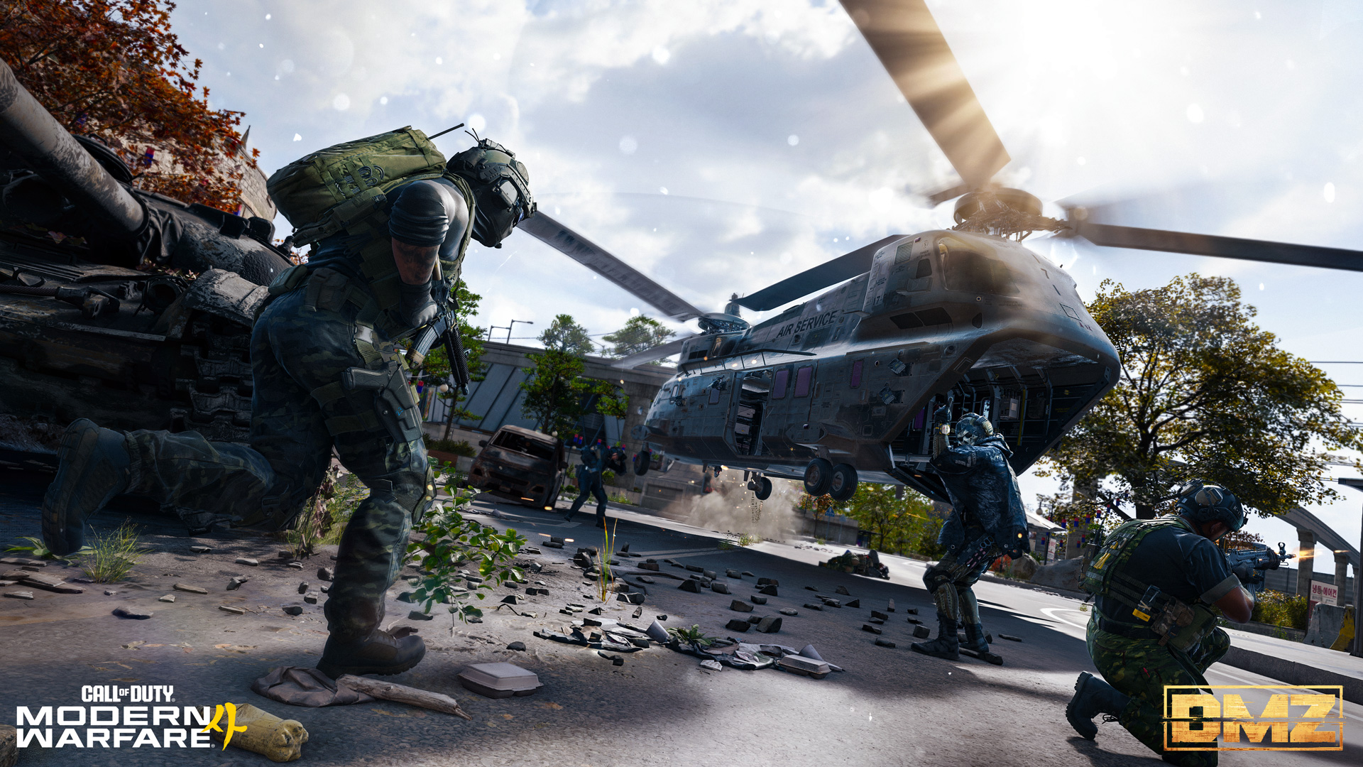 Armed soldiers defend an extraction zone as a military helicopter hovers above a debris-covered street.