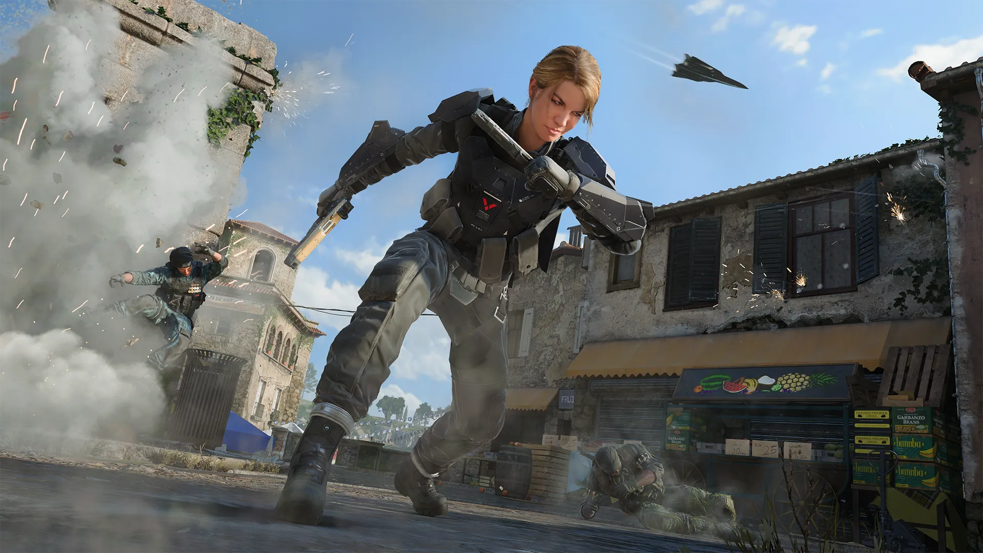 A tactical operator in armored gear lunges forward across a village plaza while explosions and gunfire erupt around market stalls and stone buildings.