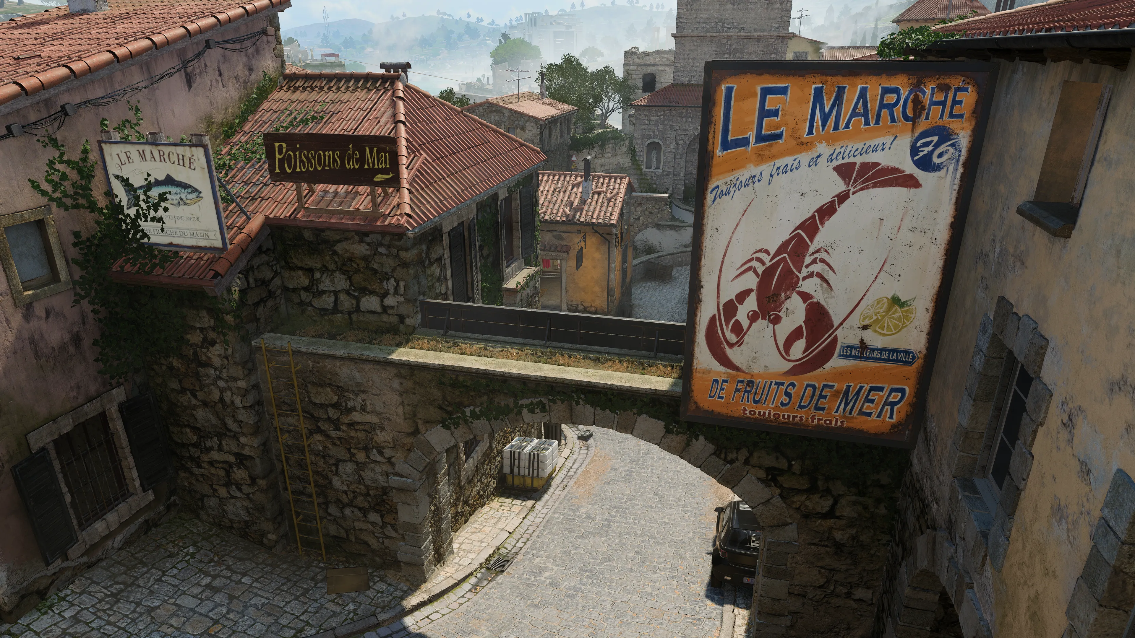 A stone bridge connecting two village buildings over a narrow cobblestone street, with large seafood market signs reading “LE MARCHÉ” and “Poissons de Mai.”