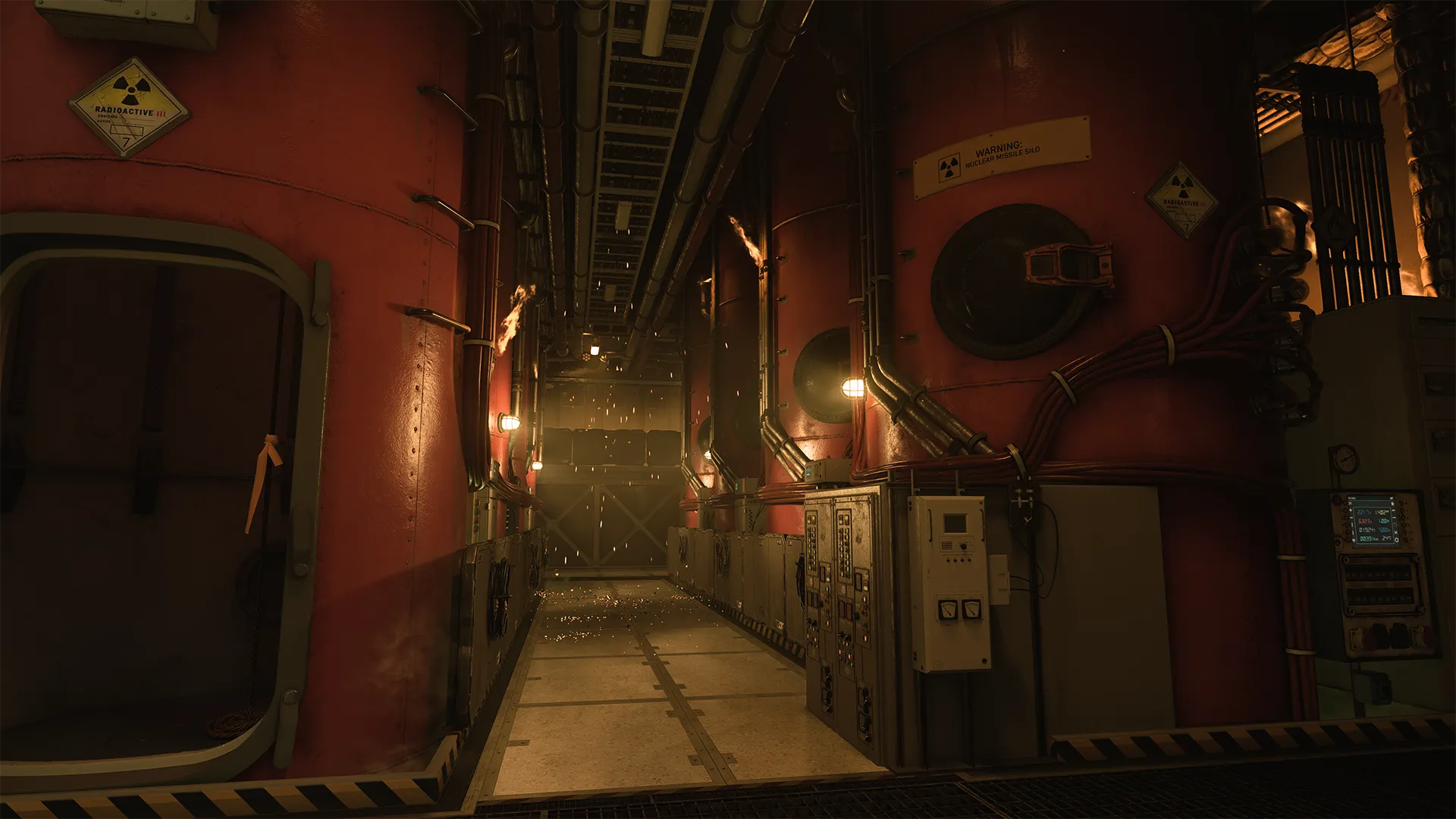 Narrow industrial corridor with red tanks, warning signs, and small flames flickering along pipes.