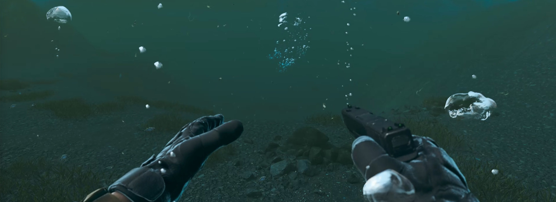 An operator brandishes a pistol underwater.