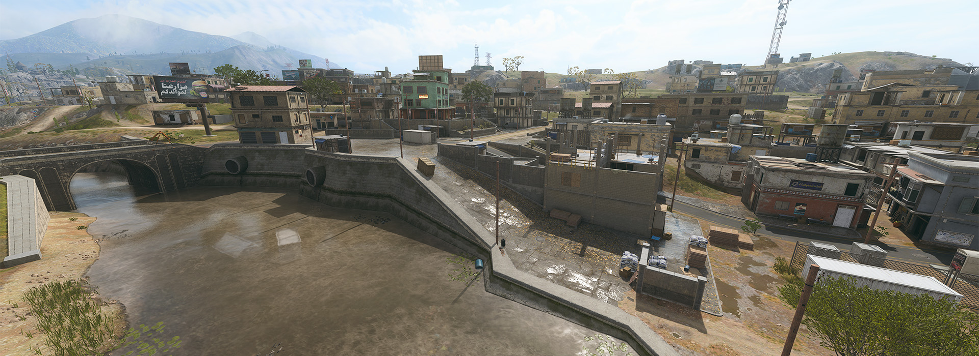 Image of Low Town, flanked with a small river. Small buildings dot the densley packed POI.